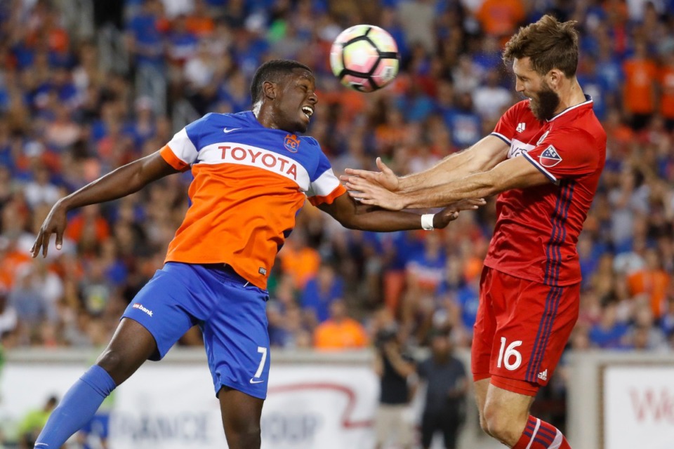 <strong>FC Cincinnati forward Kadeem Dacres (7) and Chicago Fire defender Jonathan Campbell (16) vie for a header in a U.S. Open Cup soccer match, Wednesday, June 28, 2017, in Cincinnati.</strong> (John Minchillo/AP file)