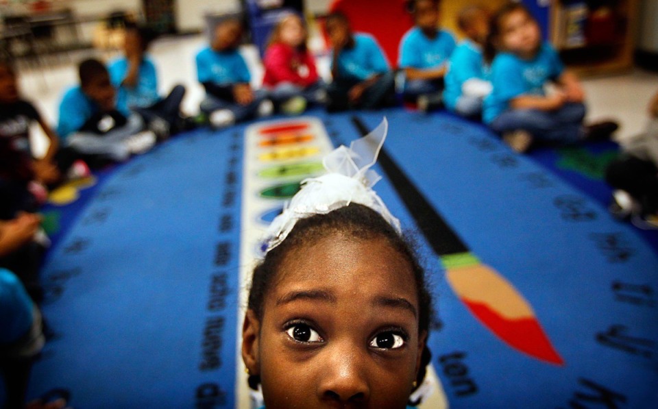 <strong>Rivercrest Elementary students (in a file photo) listen during a reading session.</strong> (Jim Weber/AP)