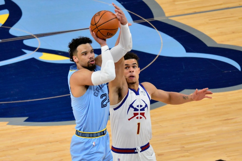 <strong>Memphis Grizzlies guard Dillon Brooks (24) shoots despite Denver Nuggets forward Michael Porter Jr. (1) on March 12 at FedExForum.</strong> (Brandon Dill/AP)