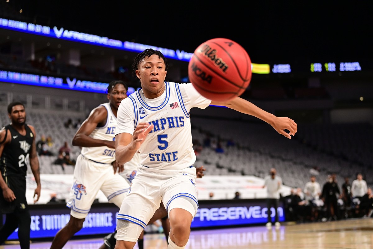 <strong>Boogie Ellis (5) chases a loose ball as the University of Memphis Tigers battle the University of Central Florida on March 12, 2021.</strong> (Courtesy American Athletic Conference/Ben Solomon)