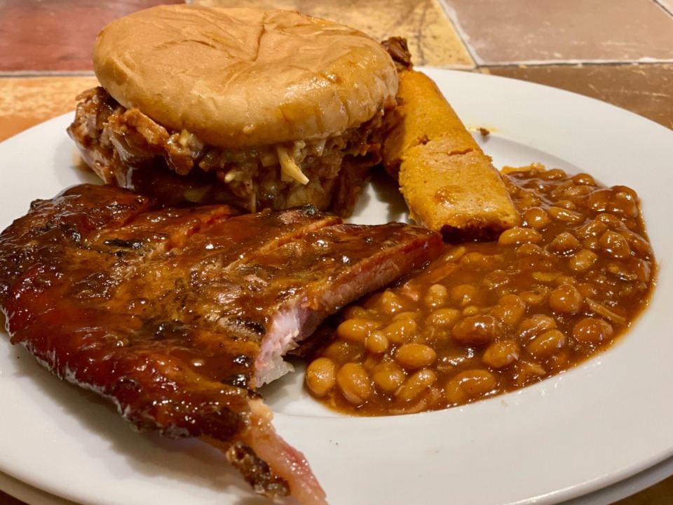 <strong>Ribs, a pork shoulder sandwich, a Memphis style beef tamale and baked beans fill a plate from A&amp;R Bar-B-Q.</strong> (Jennifer Biggs/Daily Memphian)
