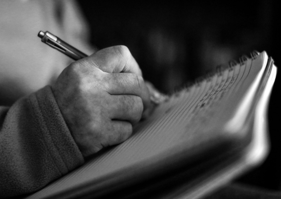 <strong>Martin Nilan writes out his wedding vows before his wedding March 21, 2020. One of Nilan's dying wishes was to marry his childhood sweetheart before he passed.</strong> (Patrick Lantrip/Daily Memphian)