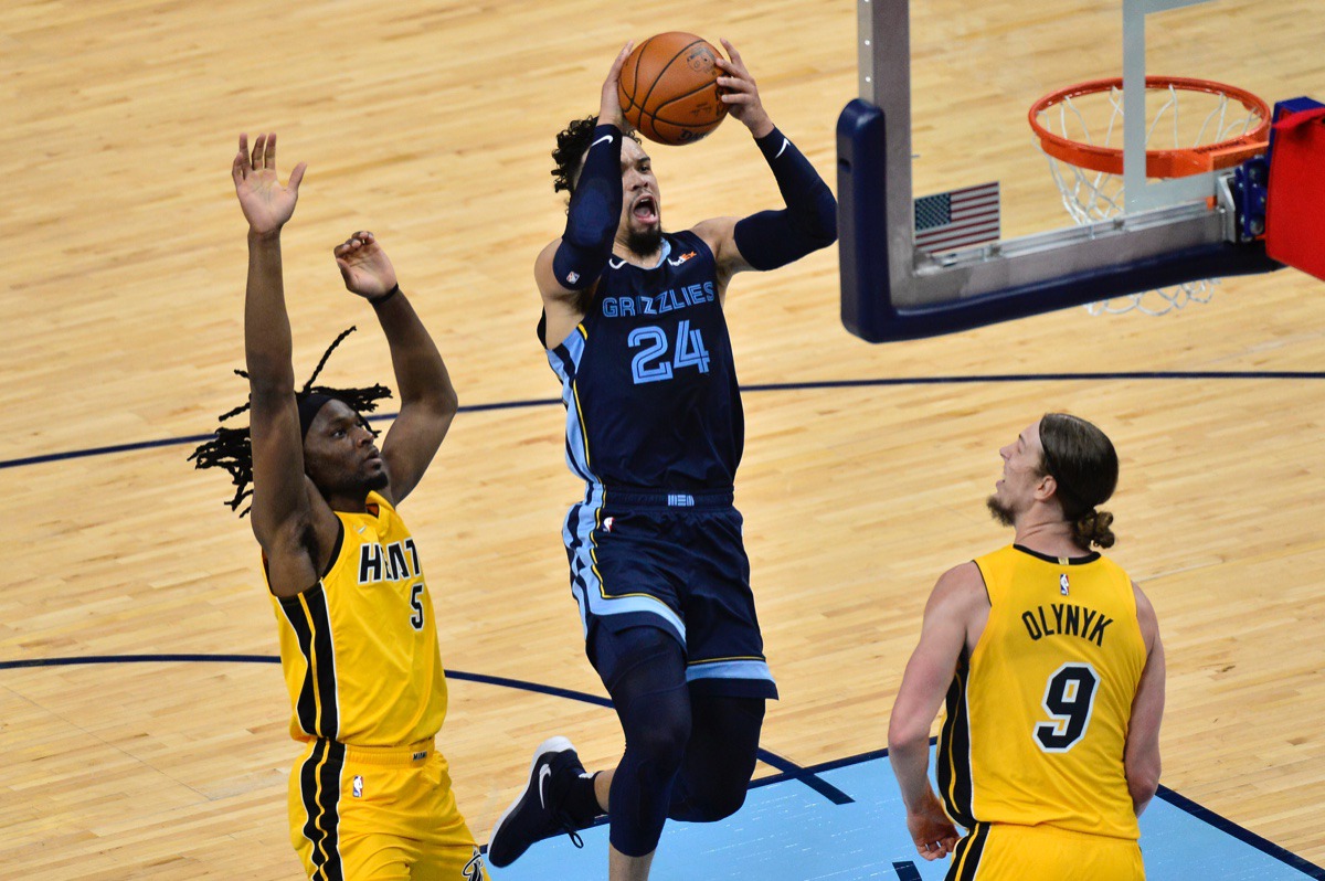 <strong>Memphis Grizzlies guard Dillon Brooks shoots against Miami Heat forwards Kelly Olynyk (9) and Precious Achiuwa (5)</strong>&nbsp;<strong>on March 17, 2021, at FedExForum.</strong> (Brandon Dill/AP)