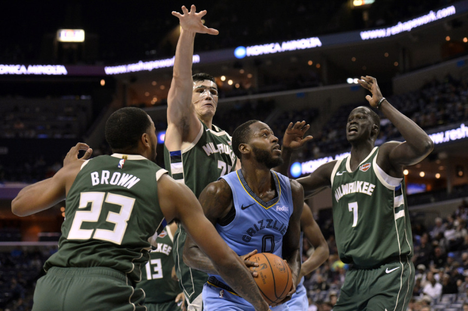 <span><strong>Memphis Grizzlies forward JaMychal Green (0) looks to shoot between Milwaukee Bucks' Sterling Brown (23), Ersan Ilyasova (77) and Thon Maker (7) during the second half of an NBA basketball game Wednesday, Jan. 16, 2019, in Memphis, Tenn.</strong> (AP Photo/Brandon Dill)</span>