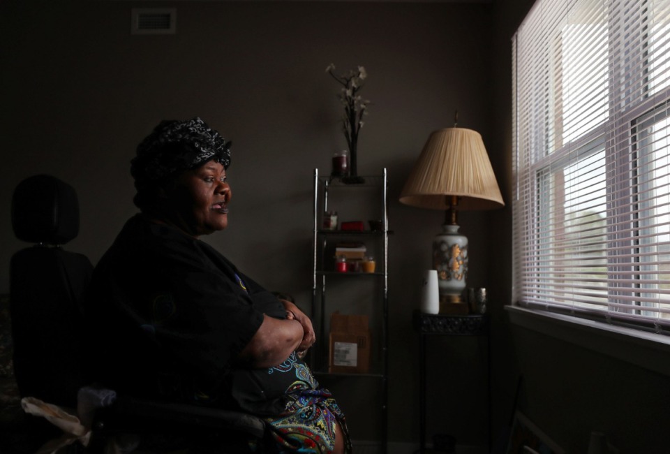 <strong>Larchena Jordan looks out the window of her apartment at the newly renovated Renaissance at Steele complex in Frayser on Thursday, March 18.</strong> (Patrick Lantrip/Daily Memphian)