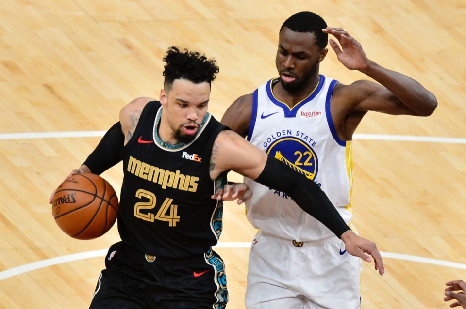 <strong>Grizzlies forward Dillon Brooks (24) handles the ball against Golden State Warriors forward Andrew Wiggins (22)&nbsp;on March 19 at FedExForum. </strong>(Brandon Dill/AP)