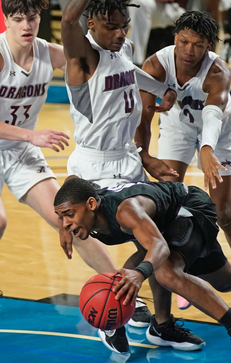 <strong>Cane Ridge&rsquo;s Brandon Miller (24) tries to escape pressure from the Collierville defense&nbsp;on March 19 in Murfreesboro, Tennessee.</strong> (Courtesy Larry McCormack/Special to The Daily Memphian)