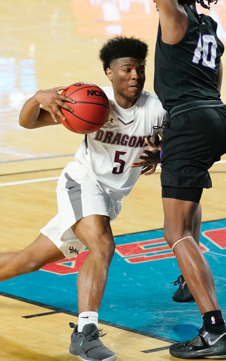 <strong>Collierville guard Danny Perry (5) tries to make his own lane as Collierville plays Cane Ridge&nbsp;on March 19 in Murfreesboro, Tennessee.</strong> (Courtesy Larry McCormack/Special to The Daily Memphian)