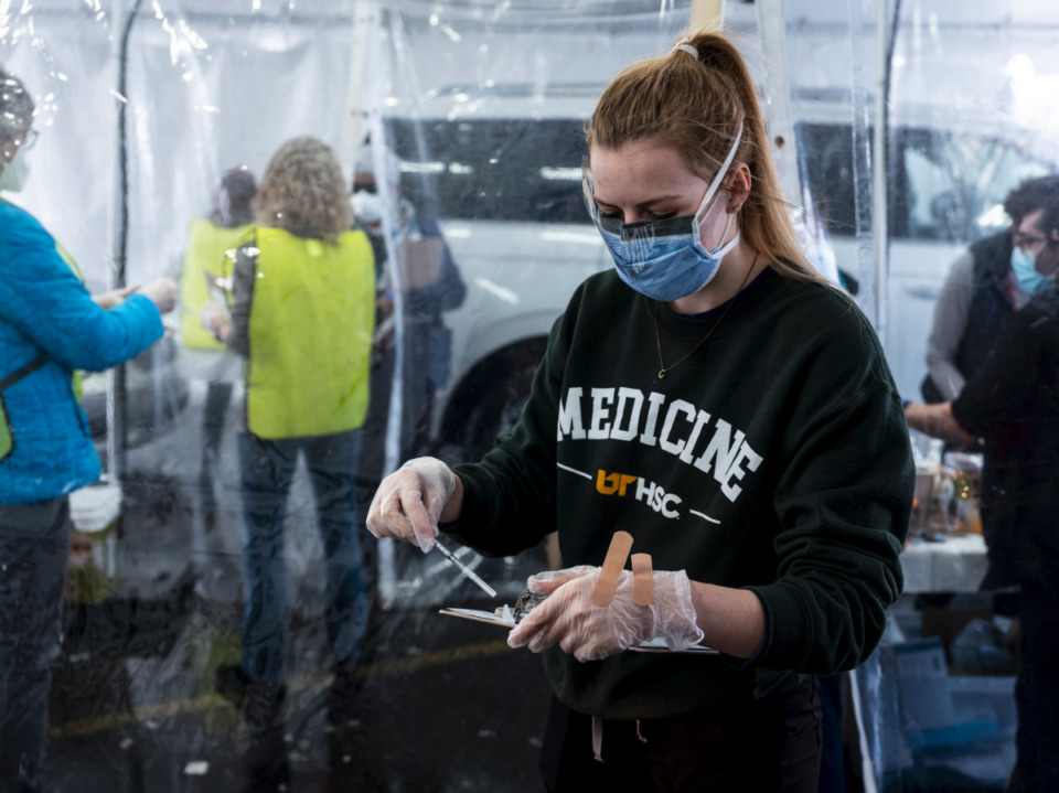 <strong>Whitney Gulledge, a first-year UTHSC medical student, prepares to administer a vaccination on Sunday, Feb. 21, 2021 at Southwest Tennessee Community College - Whitehaven Center. </strong>(Daily Memphian file)<strong><br /></strong>