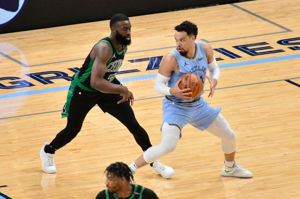 <strong>Grizzlies forward Dillon Brooks looks for an open man against Boston Celtics guard Jaylen Brown (7)</strong>&nbsp;<strong>on March 22 at FedExForum.</strong> (Brandon Dill/AP)