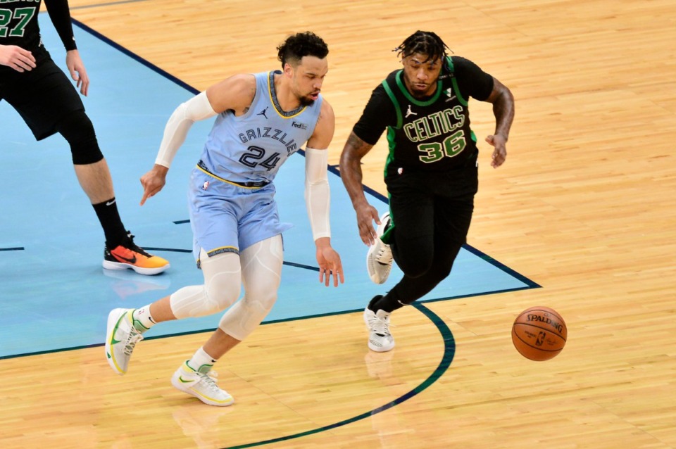 <strong>Celtics guard Marcus Smart (36) and Grizzlies forward Dillon Brooks (24) chase a loose ball&nbsp;on March 22 at FedExForum.</strong> (Brandon Dill/AP)