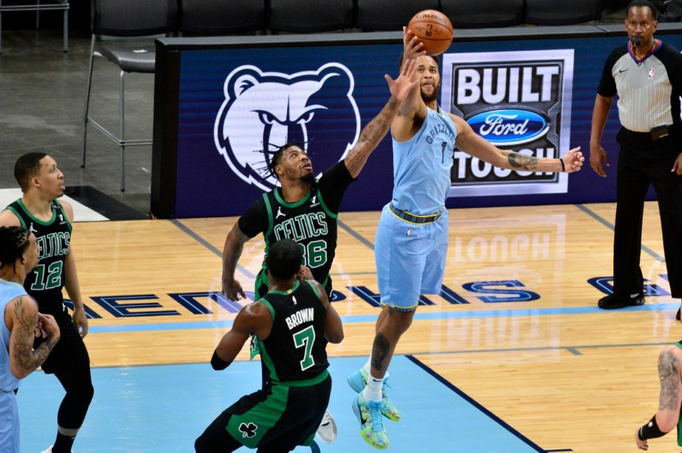 <strong>Celtics guard Marcus Smart (36) and Grizzlies forward Kyle Anderson (1) reach for the ball on March 22 at FedExForum.</strong> (Brandon Dill/AP)
