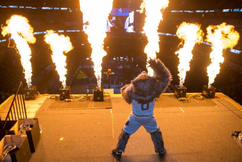 <strong>Grizzlies mascot Grizz leads a pyrotechnics display before the NBA basketball game against the Boston Celtics</strong>&nbsp;<strong>on March 22 at FedExForum.</strong> (Brandon Dill/AP)
