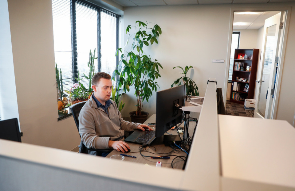 <strong>CBIZ CPA Chris Deneweth works at his desk on Monday, March 22, 2021. CBIZ has renovated the office space it leases in Clark Tower.</strong> (Mark Weber/The Daily Memphian)