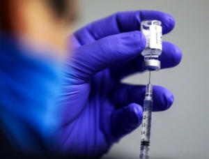 <strong>Firefighter Philip Cole loads up a dose of Johnson &amp; Johnson vaccine March 19, 2021. The most enthusiastic response to the survey was the 85% who reported being satisfied with the vaccination procedure and the way it rolled out.</strong> (Patrick Lantrip/Daily Memphian)