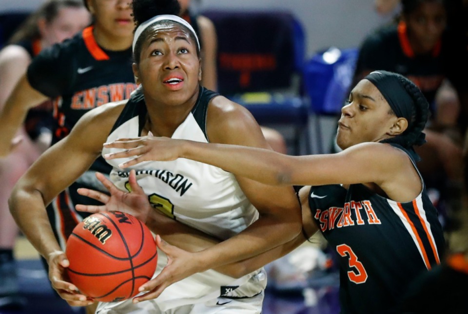 <strong>Player of the Year is Hutchison forward Carmyn Harrison (left) driving the lane against Ensworth defender Deayonna Cambridge (right) during action of the Division II Class AA semi-finals game on Friday, March 5, 2021 in Cookeville.</strong> (Mark Weber/The Daily Memphian)