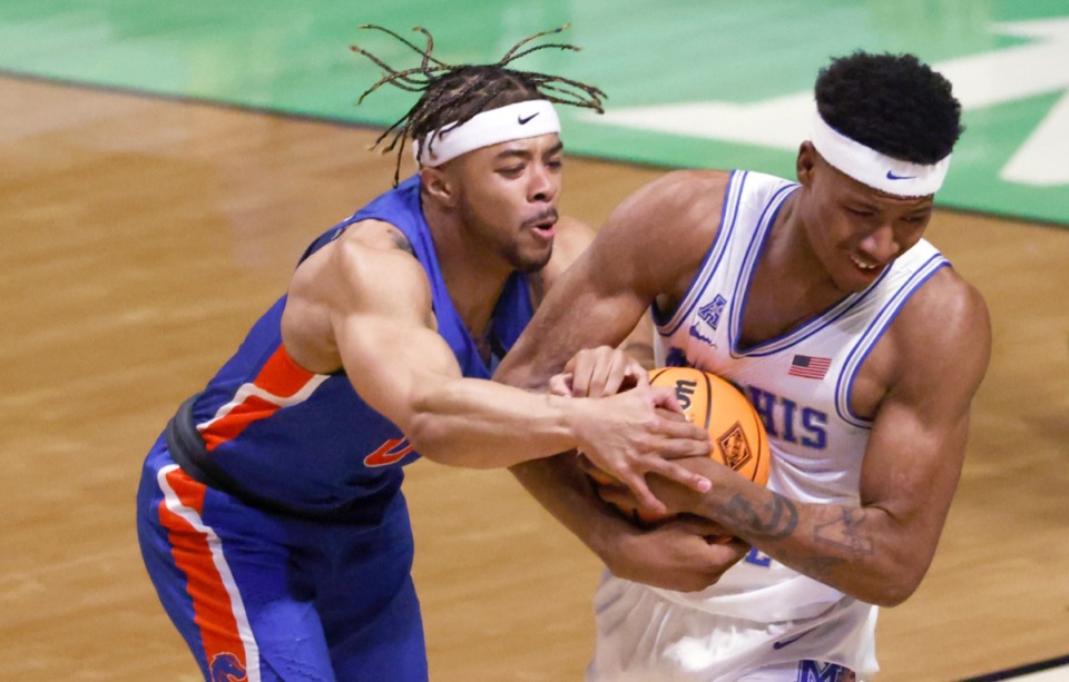 <strong>Boise State guard Marcus Shaver Jr. (0) and Memphis guard Landers Nolley II (3) wrestle for control of the ball on March 25 in Denton, Texas.</strong> (Ron Jenkins/AP)