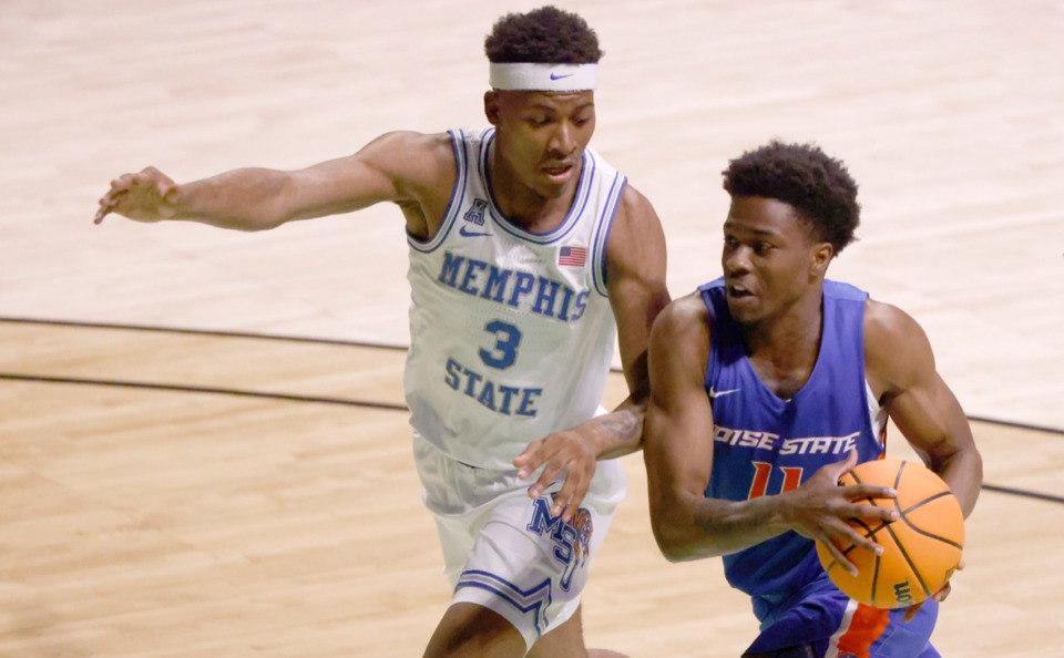 <strong>Memphis guard Landers Nolley II (3) tries to block a drive from Boise State guard Devonaire Doutrive (11) on March 25 in Denton, Texas.</strong> (Ron Jenkins/AP)