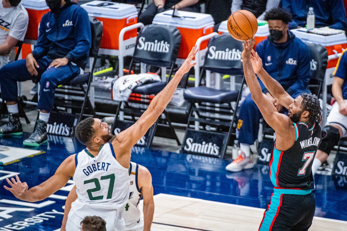 <strong>Grizzlies forward Justise Winslow (7) shoots over Utah Jazz center Rudy Gobert (27)</strong>&nbsp;<strong>on March 26, in Salt Lake City.</strong> (Isaac Hale/AP)
