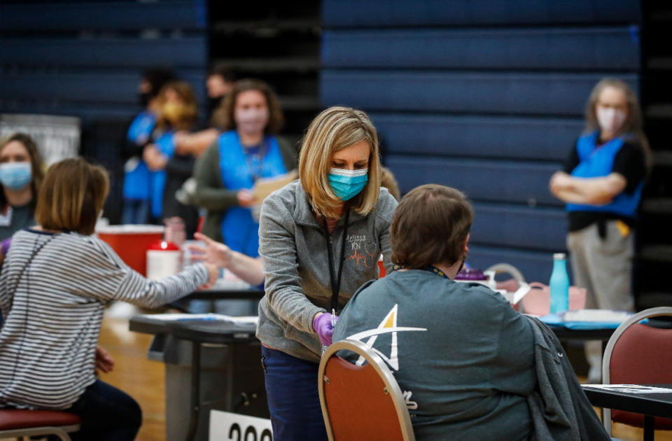 <strong>Volunteers administer vaccine shot to municipal and school employees from Arlington, Millington, and Lakeland during Arlington High School&rsquo;s vaccination event on Friday, March 26, 2021.</strong> <strong>The Health Department reported 106 new COVID cases and two additional deaths Saturday, March 27.</strong> (Mark Weber/The Daily Memphian)