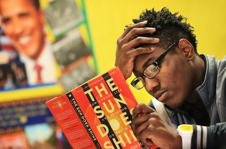 <strong>Alante Kyles finishes an in-class assignment during John Malbrough's Facing History and Ourselves class at Martin Luther King College Prep High School, formerly known as Frayser High, on Jan. 17, 2019. MLK College Prep is facing the challenges of a student body drawn from an area of high poverty and crime rates without flinching from its mission as a community charter.</strong> (Jim Weber/Daily Memphian)