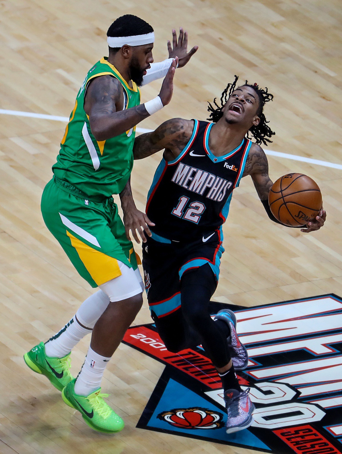 <strong>Grizzlies point guard Ja Morant (12) gets fouled by the Utah Jazz on March 31.</strong> (Patrick Lantrip/Daily Memphian)