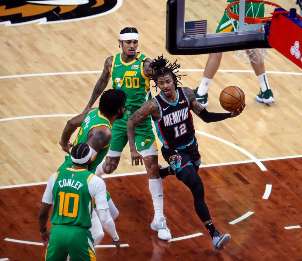 <strong>Memphis Grizzlies point guard Ja Morant (12) cuts through the Utah Jazz defense on March 31 at FedExForum.</strong> (Patrick Lantrip/Daily Memphian)