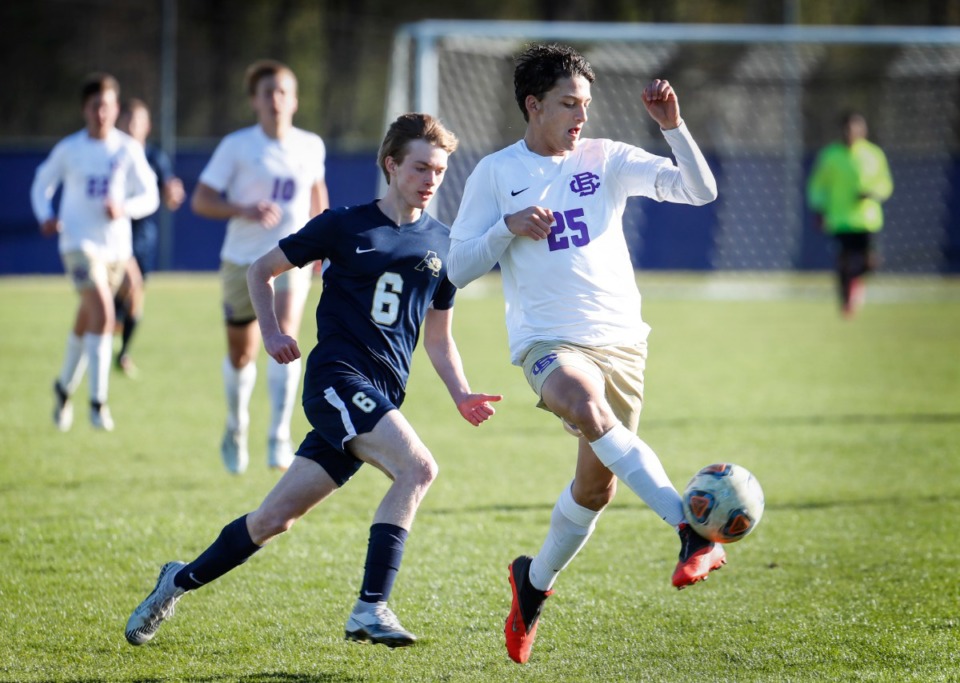 <strong>CBHS defender Hunter Lomasney (front) kicks the ball to the goalkeeper in the game against Arlington on April 1.</strong> (Mark Weber/The Daily Memphian)