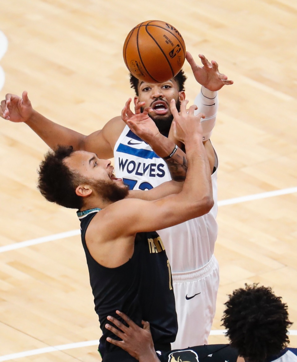 <strong>Grizzlies forward Kyle Anderson (front) has his shot blocked by Minnesota&rsquo;s Karl-Anthony Towns (back) on April 2.</strong> (Mark Weber/The Daily Memphian)