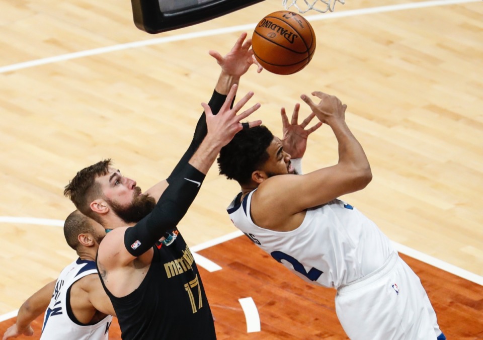 <strong>Grizzlies center Jonas Valanciunas (left) grabs a rebound away from Minnesota&rsquo;s Karl-Anthony Towns (right) on April 2.</strong> (Mark Weber/The Daily Memphian)