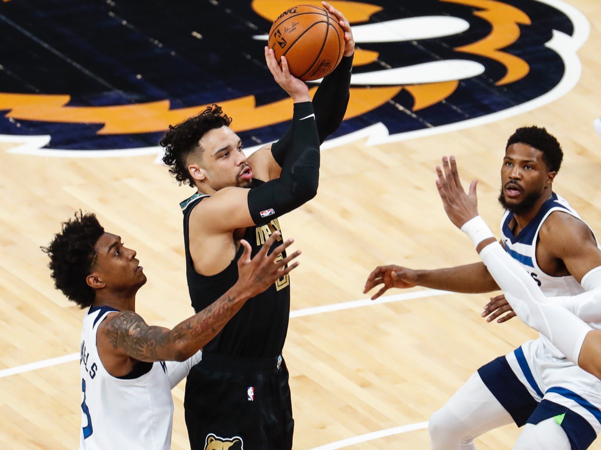 <strong>Grizzlies guard Dillion Brooks (middle) shoots against Minnesota on April 2.</strong> (Mark Weber/The Daily Memphian)