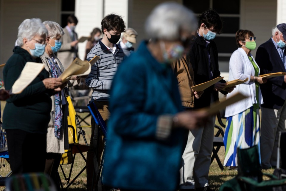 <strong>Congregants stand to pray during the St. George&rsquo;s Episcopal Church outdoor Easter service in Germantown.</strong> (Brad Vest/Special to The Daily Memphian)