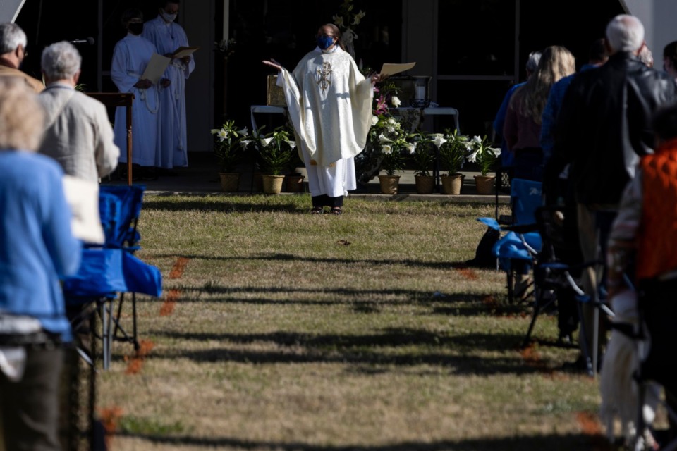 <strong>Orange squares painted on the grass encourage social distancing&nbsp; at St. George&rsquo;s Episcopal Church where Rev. Dr. Dorothy Sanders Wells leads the Easter service.</strong> (Brad Vest/Special to The Daily Memphian)