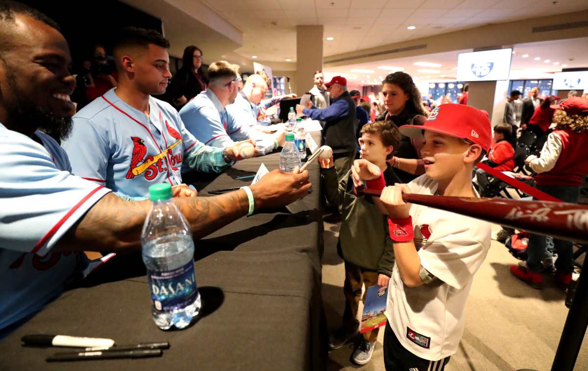 <strong>Adolis Garc&iacute;a (left), a former Redbirds right fielder, signs an autograph for Thomas Starrett (right), 10, during the Cardinals Caravan event at AutoZone Park Friday, Jan. 18, 2019. Visitors filled the second floor of the stadium to hear their favorite players speak about what it takes to make it to the major leagues.</strong> (Houston Cofield/Daily Memphian)