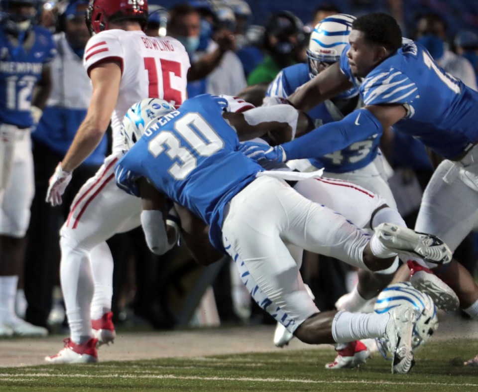 <strong>University of Memphis defensive back Rodney Owens (30) drags down an Arkansas State player during the Tigers' home opener at the Liberty Bowl Memorial Stadium on Sept. 5, 2020.</strong> (Patrick Lantrip/Daily Memphian file)