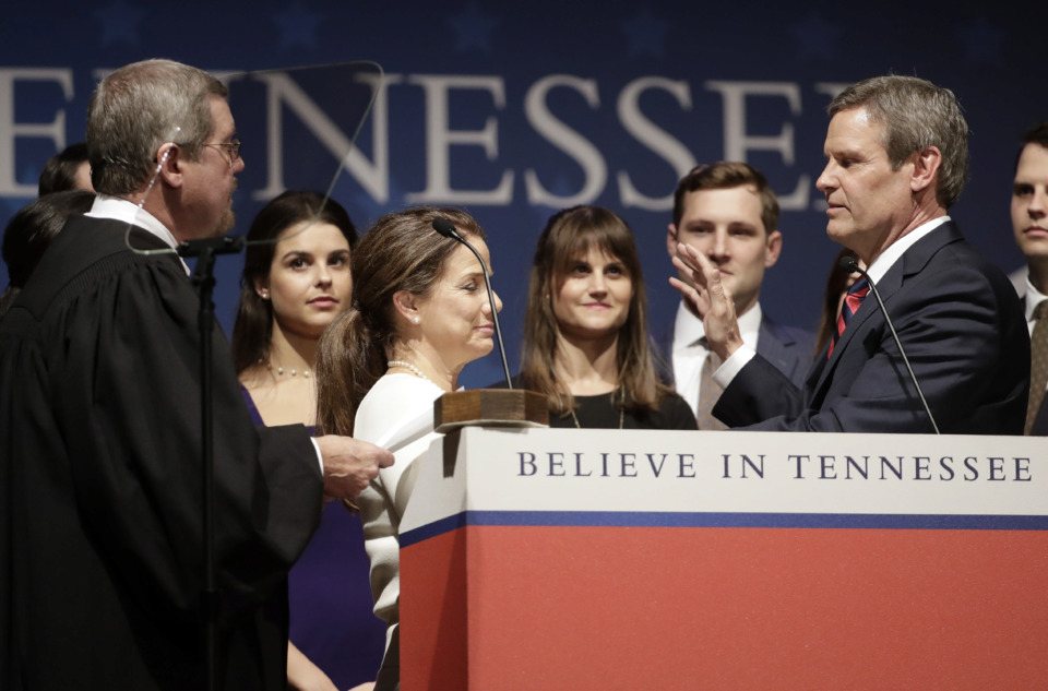 <strong>Tennessee Gov. Bill Lee, right, is sworn in by Tennessee Supreme Court Chief Justice Jeffrey Bivins, left, in War Memorial Auditorium Saturday, Jan. 19, 2019, in Nashville, Tenn.</strong> (AP Photo/Mark Humphrey)