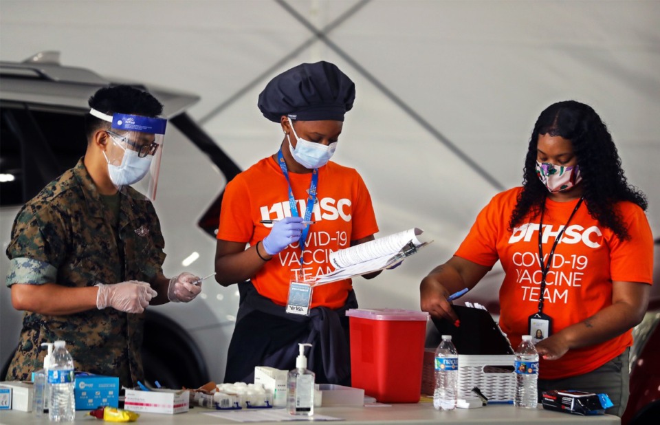 <strong>Volunteers prepare COVID-19 vaccines outside of the Pipkin Building April 7, 2021.</strong> (Patrick Lantrip/Daily Memphian)