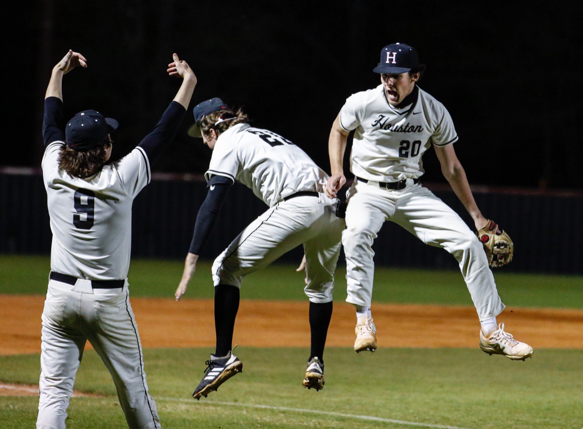 <strong>Houston relief pitcher Dean McCalla (right) celebrates an out against Collierville on April 8.</strong> (Mark Weber/The Daily Memphian)