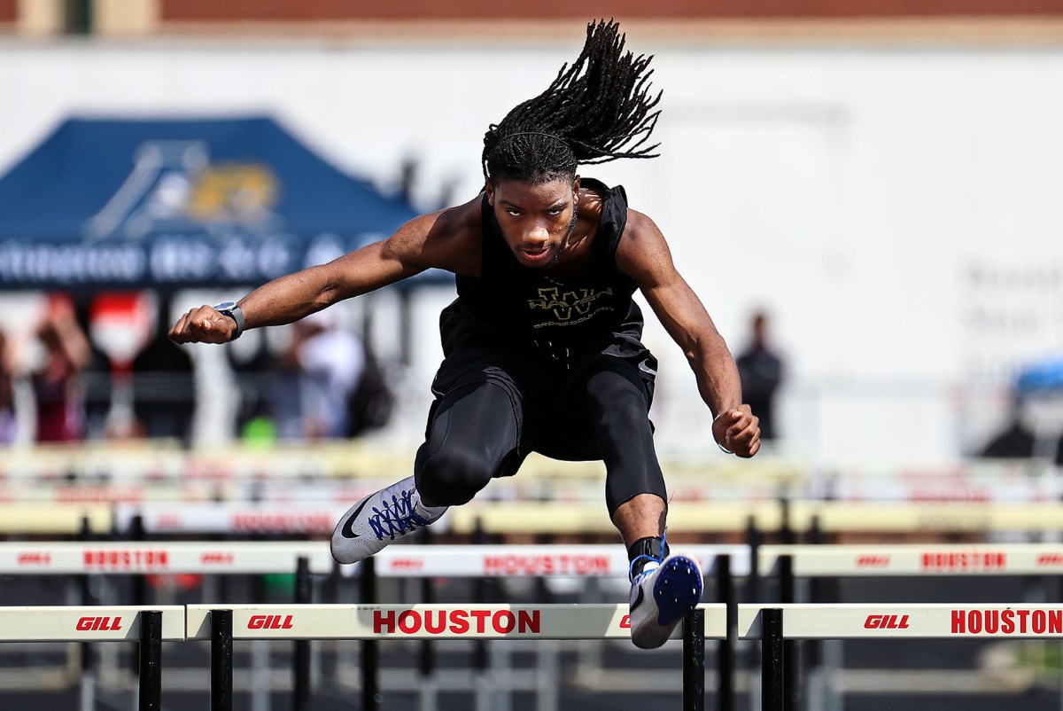 <strong>Whitehaven's Travion Jones competes in the men's 110 meter hurdles at the Houston Track and Field Classic at Houston High School April 10, 2021.</strong> (Patrick Lantrip/Daily Memphian)
