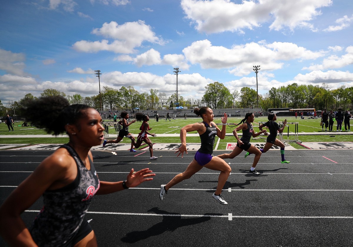 <strong>Southwind's JaCaiyah Tutwiler (center) runs in the women's 100 meter dash at the Houston Track and Field Classic at Houston High School April 10, 2021.</strong> (Patrick Lantrip/Daily Memphian)
