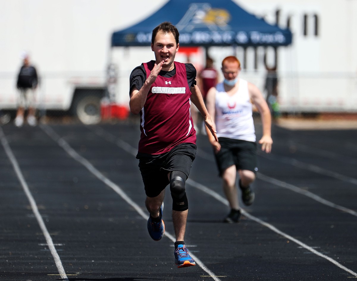 <strong>Collierville's Matthew Bell runs the unified 100 meter dash at the Houston Track and Field Classic at Houston High School April 10, 2021.</strong> (Patrick Lantrip/Daily Memphian)