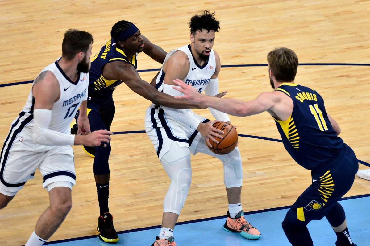 <strong>Memphis Grizzlies forward Dillon Brooks handles the ball against Indiana Pacers forwards Domantas Sabonis (11) and Justin Holiday in an NBA basketball game Sunday, April 11, 2021, at FedExForum.</strong> (Brandon Dill/AP)