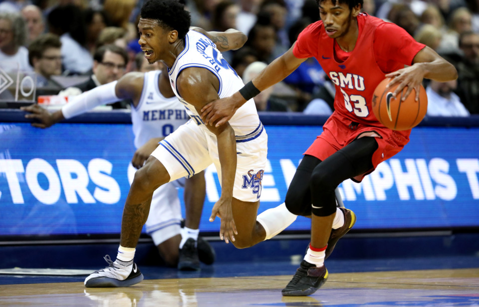 <strong>University of Memphis guard Kareem Brewton Jr. (5) lunges to steal the ball from Southern Methodist University guard C.J. White (13).</strong> (Houston Cofield/Daily Memphian)