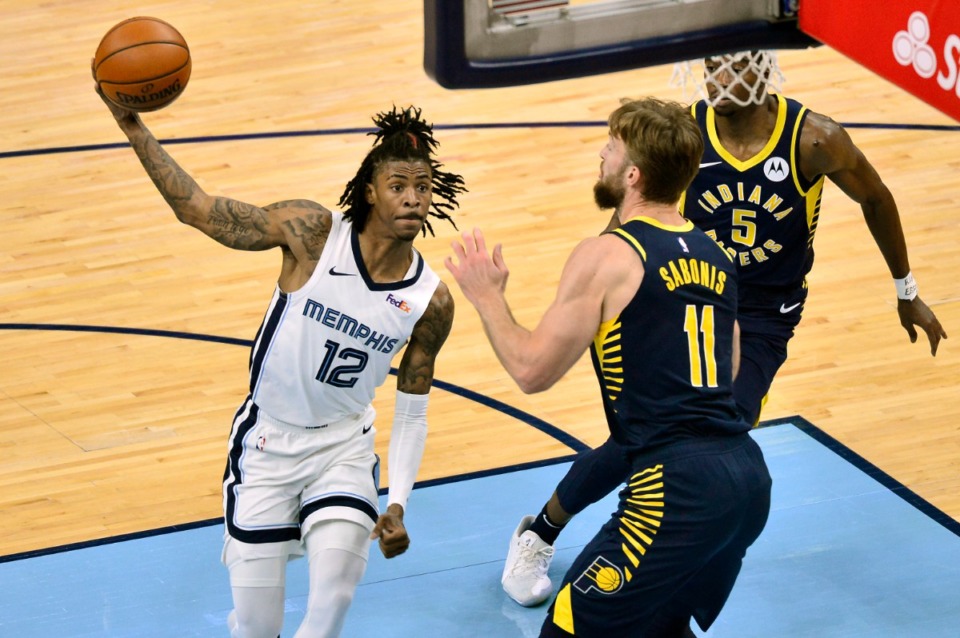 <strong>Memphis Grizzlies guard Ja Morant (12)&nbsp;handles the ball against Indiana Pacers forward Domantas Sabonis (11) in the first half of an NBA basketball game Sunday, April 11, 2021, at FedExForum. He called his team&rsquo;s slow start &lsquo;unacceptable.'</strong> (Brandon Dill/AP)