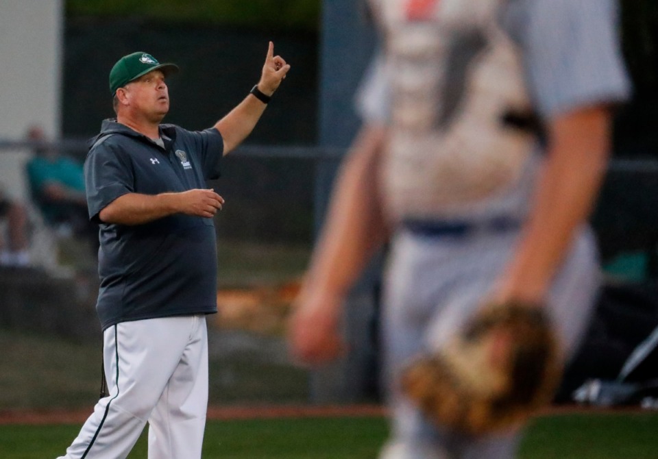 <strong>Briarcrest head coach Craig Hopkins signals to his players in the game against MUS on April 12.</strong> (Mark Weber/The Daily Memphian)