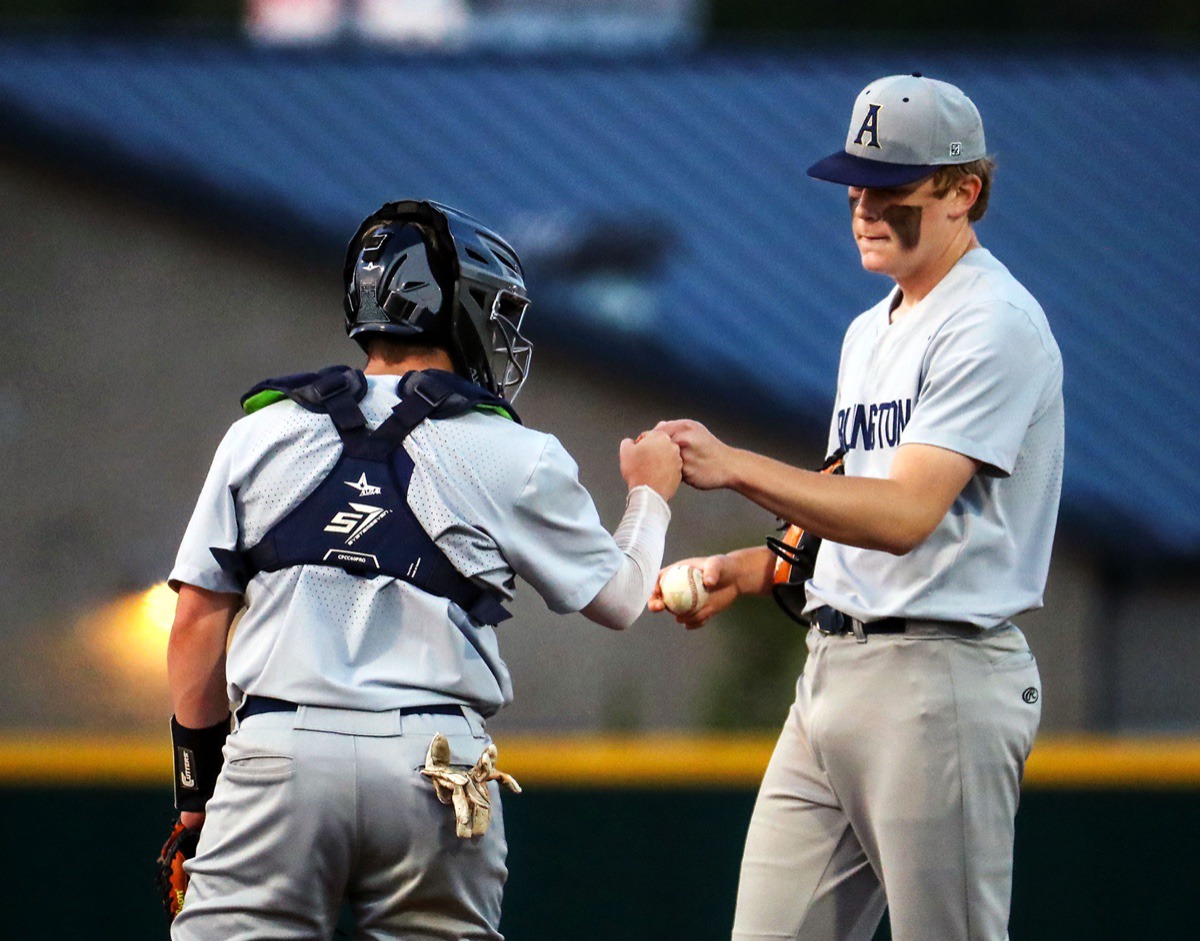 <strong>Arlington catcher Colbin Tyson fist-bumps pitcher Connor McCaslin after the former gave up a grand slam during the April 13 game against Collierville.</strong> (Patrick Lantrip/Daily Memphian)