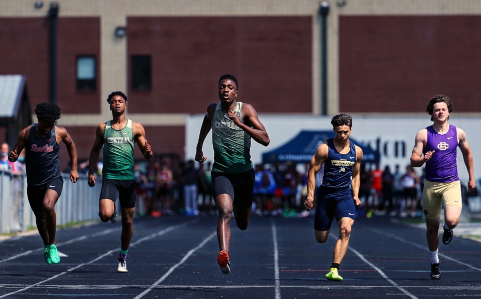 <strong>Central High School's Jordan Ware (center) wins the men's 100 meter dash at the Houston Track and Field Classic at Houston High School April 10, 2021.</strong> (Patrick Lantrip/Daily Memphian)