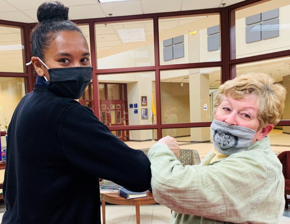 <strong>St. Benedict senior soccer player Aliyah Williamson shares a moment with Sharon Masterson at the school.</strong> (Submitted)