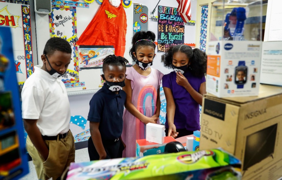 <strong>Robert R. Church Elementary students look over donated items in the school&rsquo;s new Trailblazer Incentive Store on Thursday, April 15. Students can earn points for positive behavior to buy items in the store.</strong> (Mark Weber/Daily Memphian)