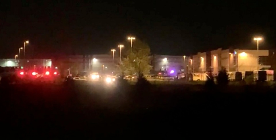 <strong>This image made from video shows a wide view of building with flashing lights from emergency vehicles in Indianapolis, IN, Friday, April 16, 2021. Police in Indianapolis say multiple people were shot and killed in a shooting late Thursday at a Fedex facility.</strong> (WRTV via AP)